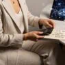 Luxury travel advisor in editorial scene reviewing crypto-native itinerary with blockchain interface and elegant styling.Luxury Travel Advisor Web3