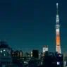 private jet landing in Tokyo with skyline view