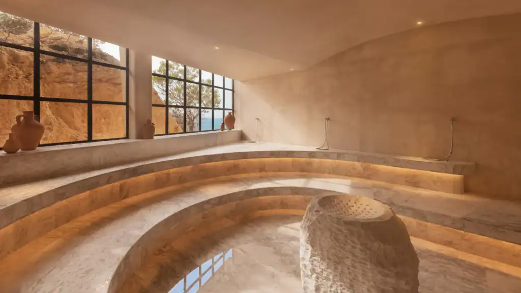Luxury wellness retreats 2025 Six Senses Ibiza spa featuring circular relaxation pool and natural stone design