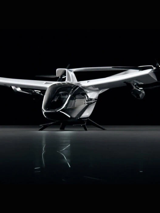 eVTOL launches August 2025 sleek aircraft flying over city skyline at sunse