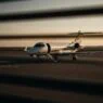 Noise abatement rules compliance at luxury airports with private jets landing silently during restricted hours