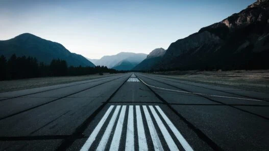 Breathtaking airport landings at challenging terrain with private jets approaching dramatic mountain airports