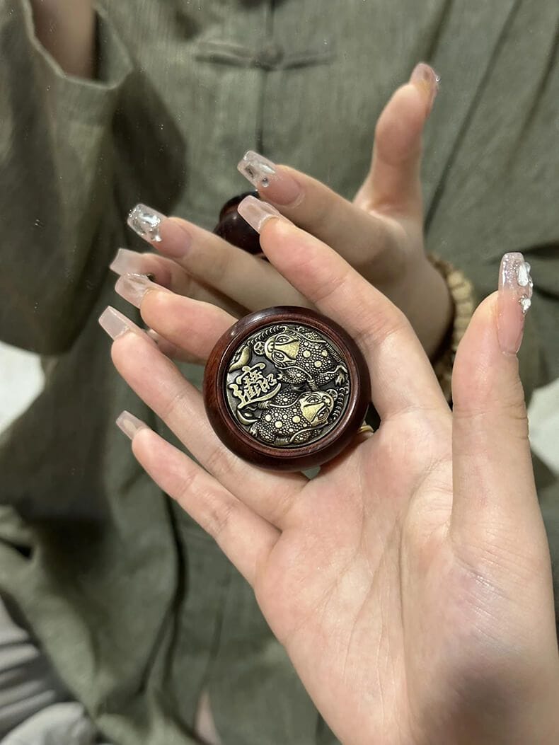 犀牛角紫檀聚寶盆轉轉手把件