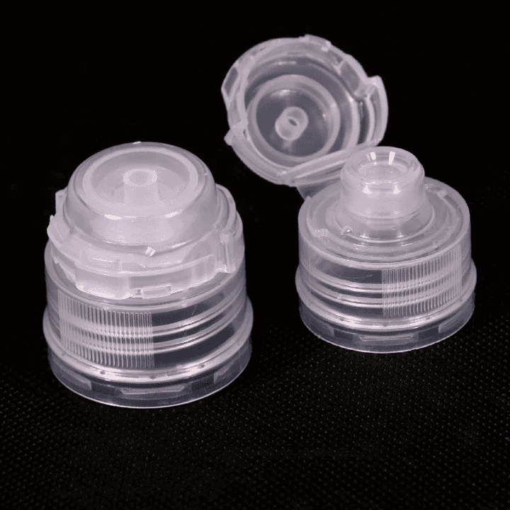 Squeeze bottle caps, transparent plastic closure, portable container lids for cosmetics, pharmaceuticals, or industrial use.