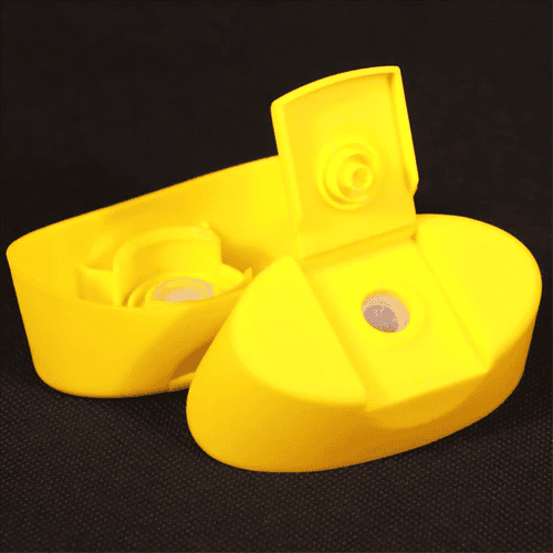 Yellow pill organiser with detachable compartments for medication management, set against a black background for easy visibility. Ideal for organised medication storage and health monitoring.