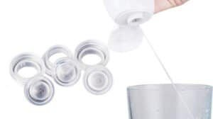 Surgical or cosmetic filler vials and syringe being prepared for injection, close-up of medical supplies for aesthetics or dermatology treatments.
