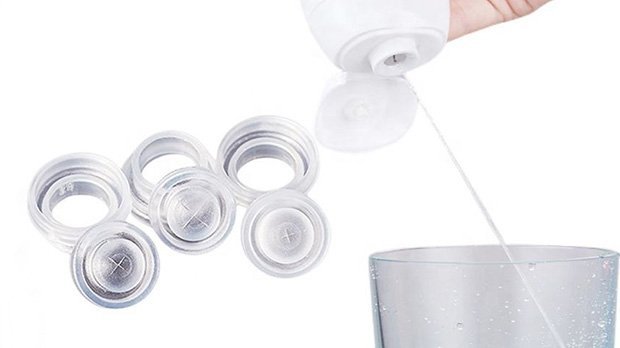 Surgical or cosmetic filler vials and syringe being prepared for injection, close-up of medical supplies for aesthetics or dermatology treatments.
