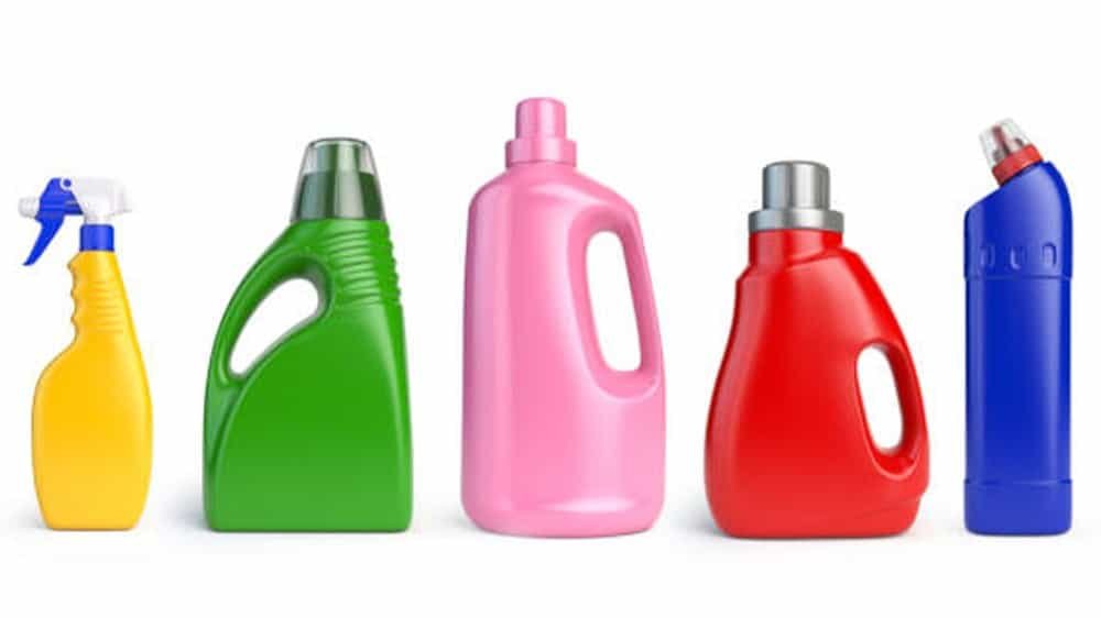 Generic cleaning spray bottles in various colours, indicating cleaning products and tools for household or commercial cleaning.