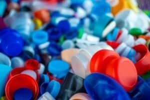 Recycling plastic bottle caps for environmental sustainability and waste reduction in waste management processes.