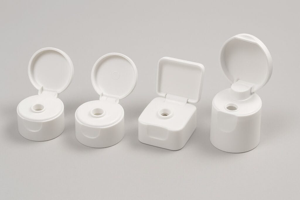 Disposable hand sanitizer bottle caps in different styles for hygiene and safety.