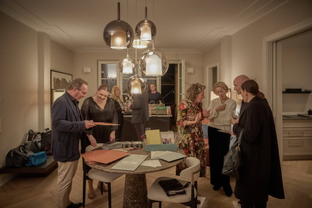 Elegant social gathering at Ralf Schmitz event in a stylish modern home setting.