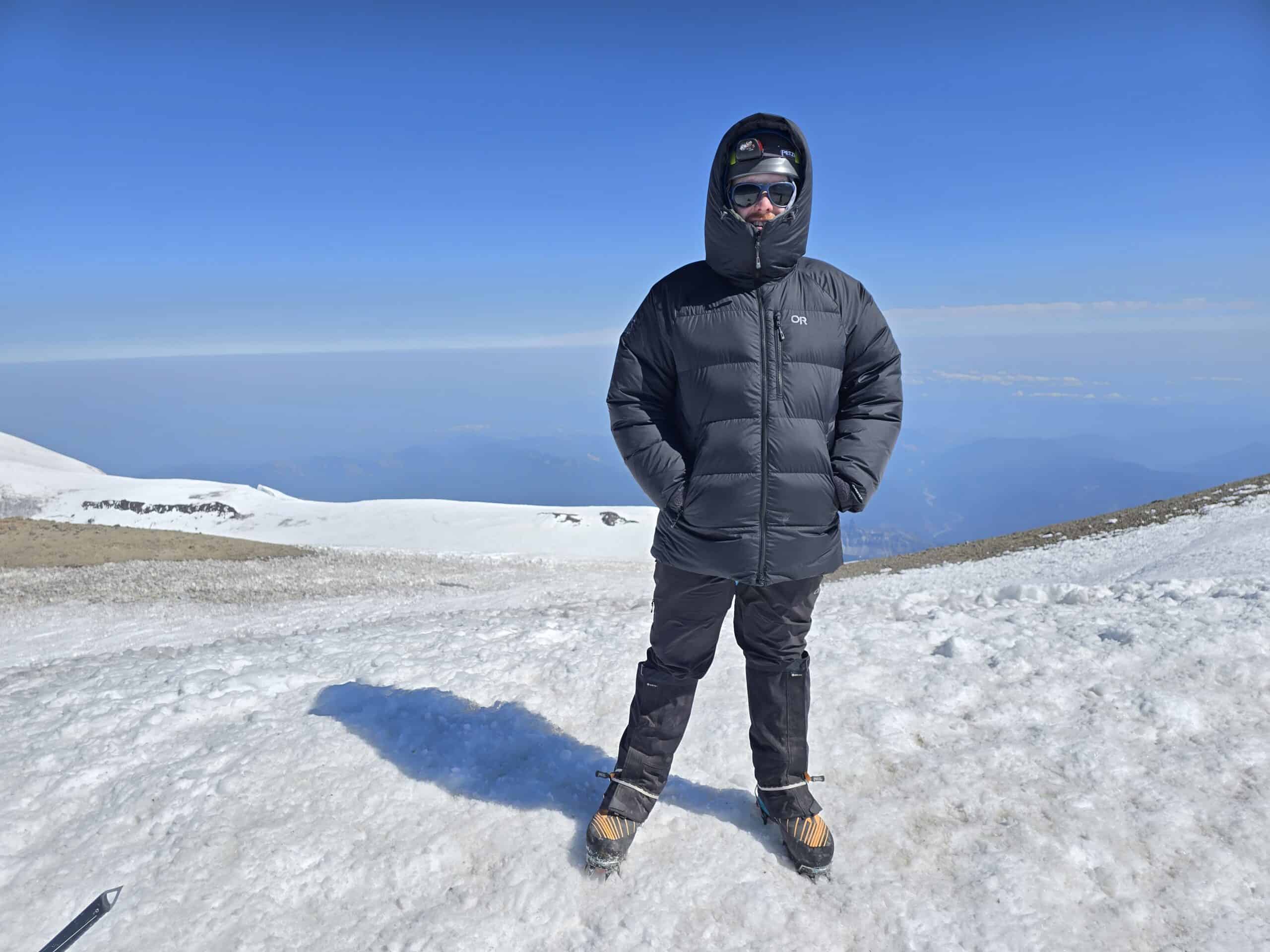 Man standing on the top of Mt. Rainier