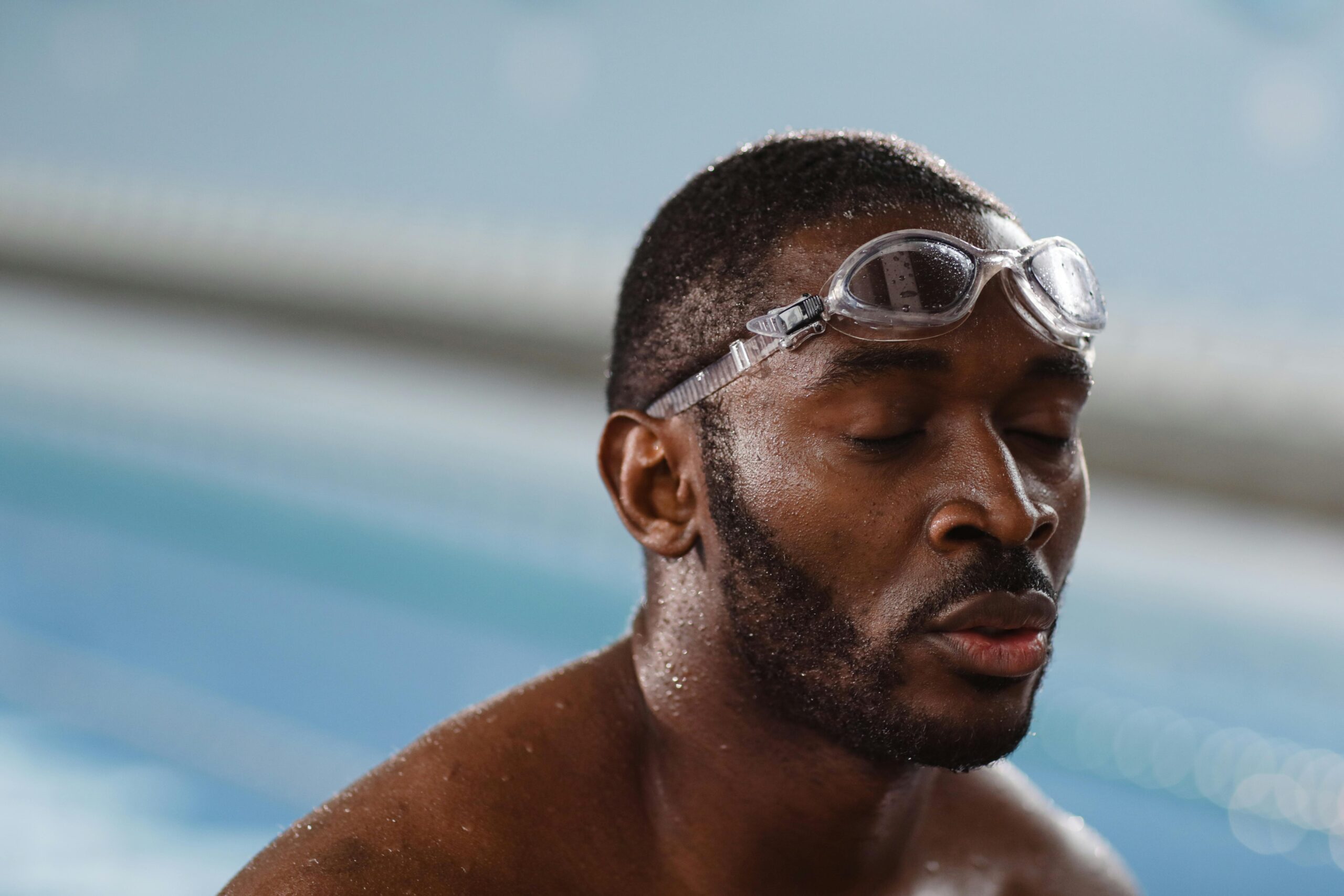 Black swimmer catching his breath after a swim session
