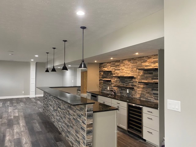 Contemporary kitchen with sleek cabinets and lighting
