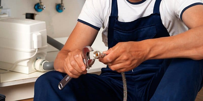 a plumber is fixing a supply line – 800400 a plumber is fixing a supply line 800400