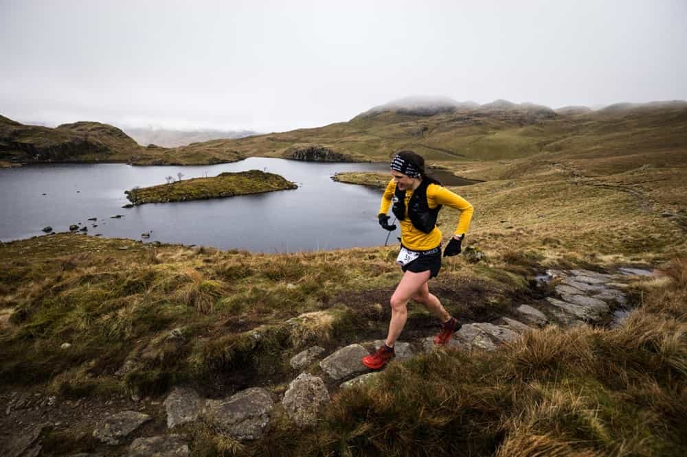Katie Kaars Sijpesteijn strides through Patterdale during the 2023 SILVA Lakes Traverse - copyright No Limits Photography (002)