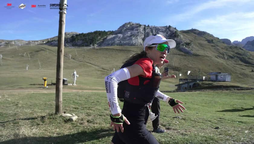 A person running in a field AI-generated content may be incorrect.