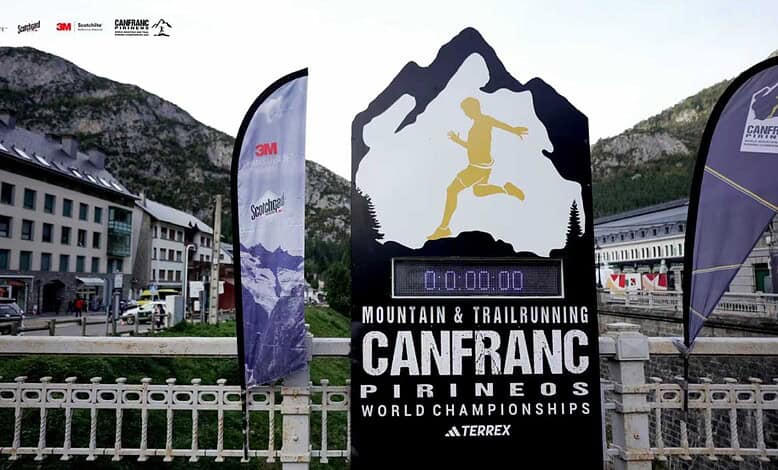 Running Insights logo and event signage at the CANFRANC Mountain & Trail Running World Championships in the Pyrenees, showcasing mountain trail running excellence and upcoming race insights.