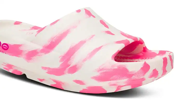 Lightweight running shoe with pink and white tie-dye pattern, designed for comfort and performance during running activities.