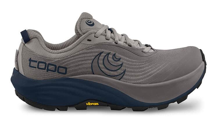 Light grey and navy blue trail running shoe with Vibram sole, designed for outdoor running and trail adventures.