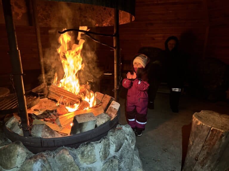 Lunch by the fire in Finnish kota Ivalo