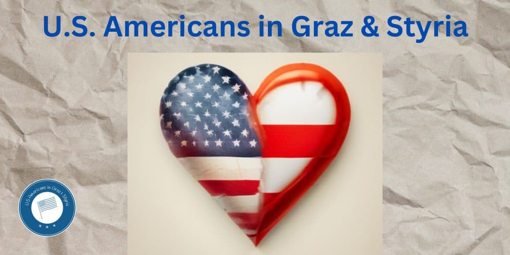 Heart with half showing a US American flag and half showing an Austrian flag on a gray background.
