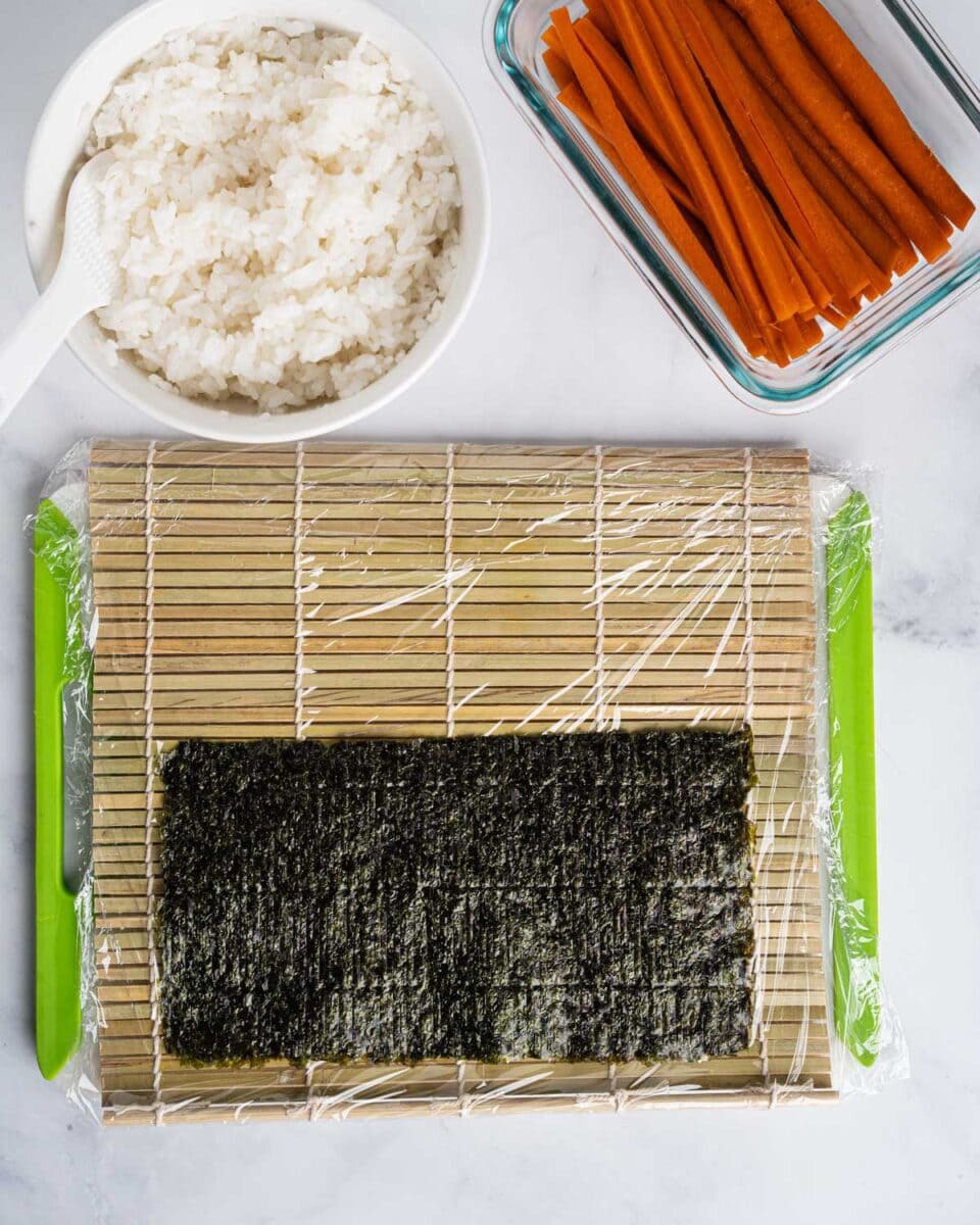Seaweed on a sushi mat.