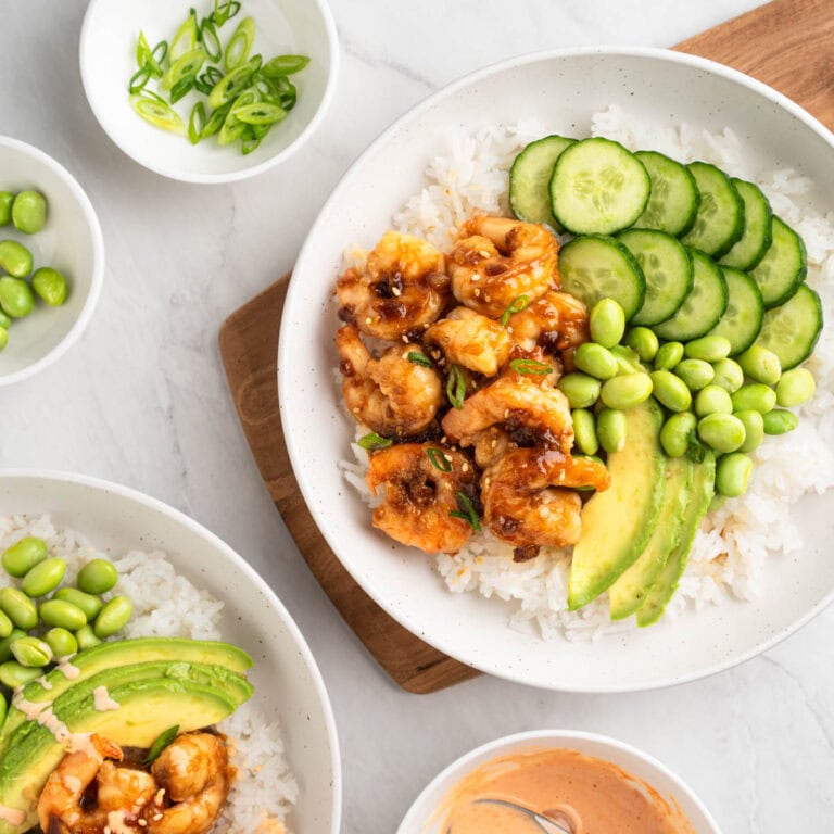 Rice bowl with honey garlic shrimp, cucumbers, edamame and avocado.