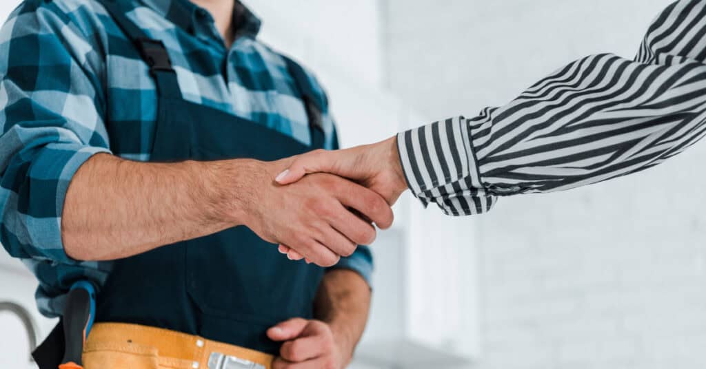 Handshake between technician and client after completing service work