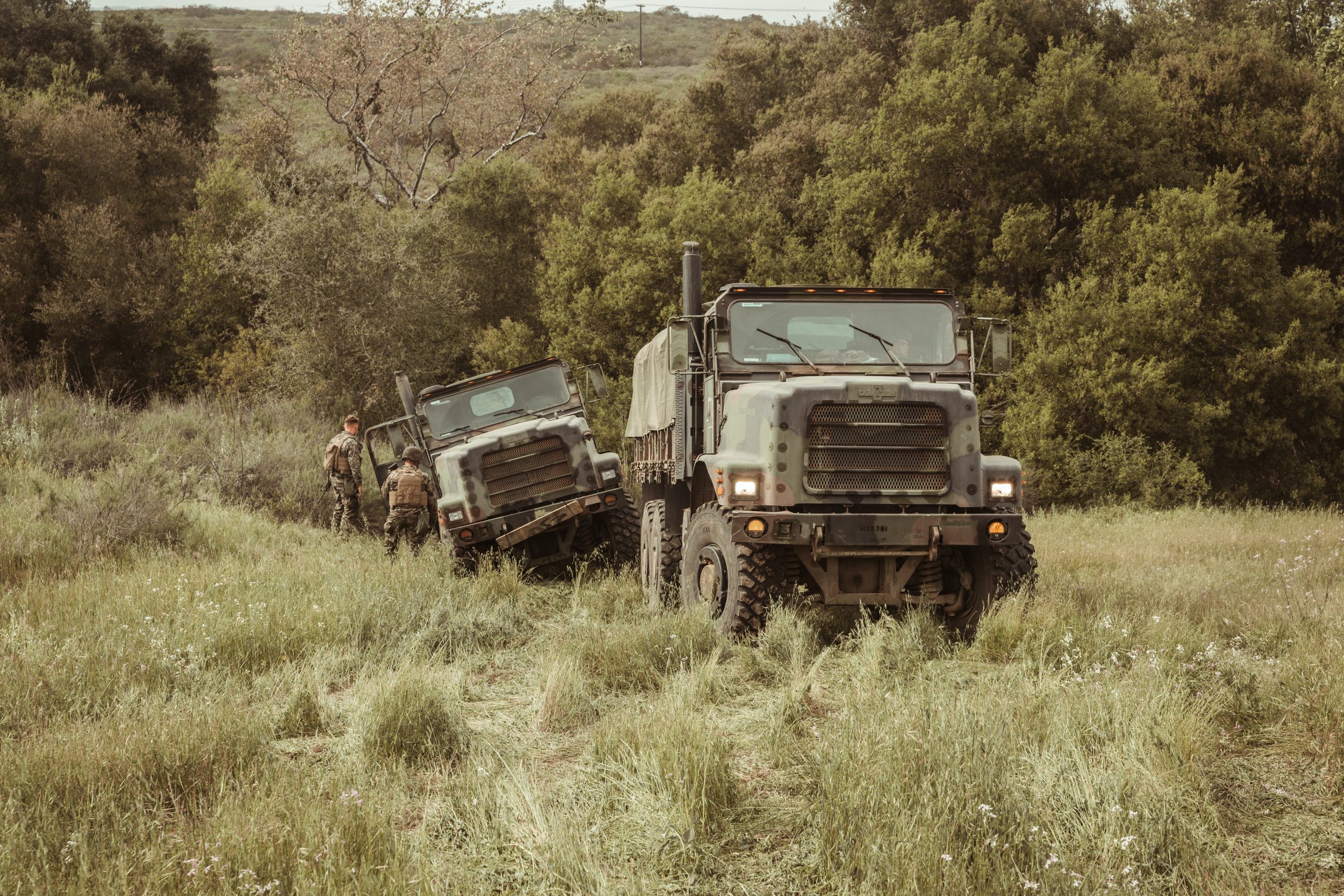 Two armored military vehicles off-road