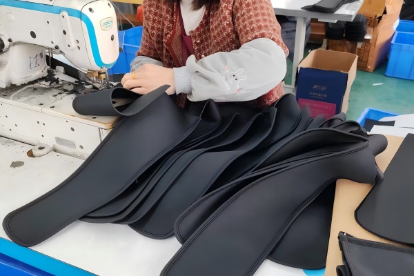 Body shaping garment hemming process