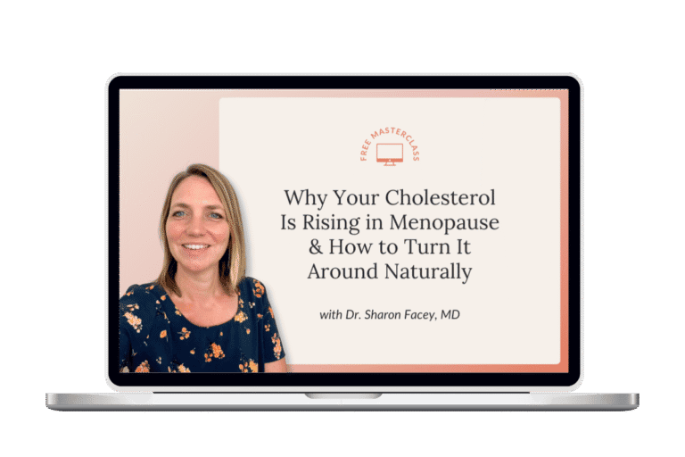 Laptop screen displaying Dr. Sharon Facey, MD, and a banner for her free masterclass titled “Why Your Cholesterol Is Rising in Menopause & How to Turn It Around Naturally.”