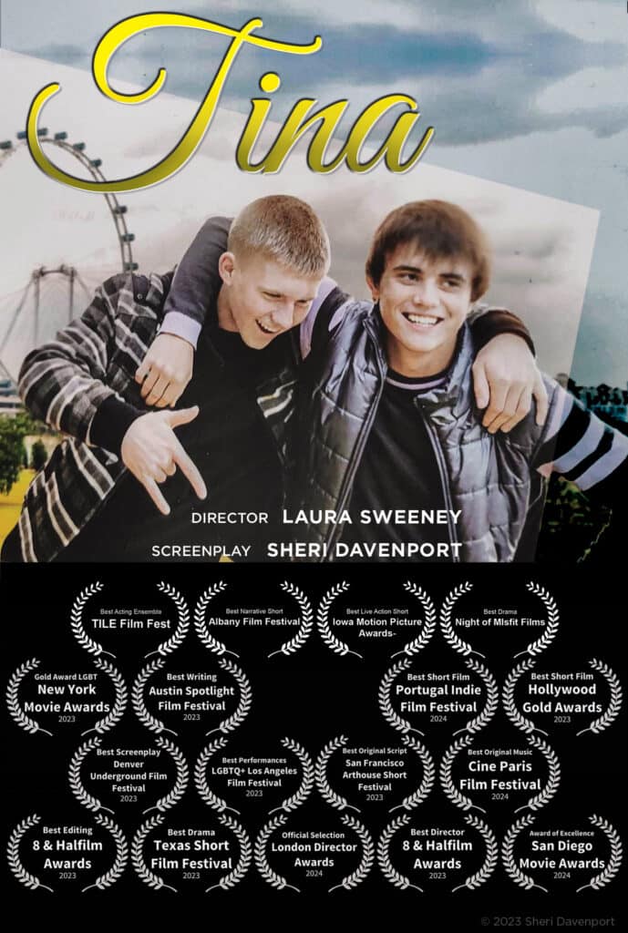 Two young boys smiling and hugging outdoors, with a cloudy sky background.