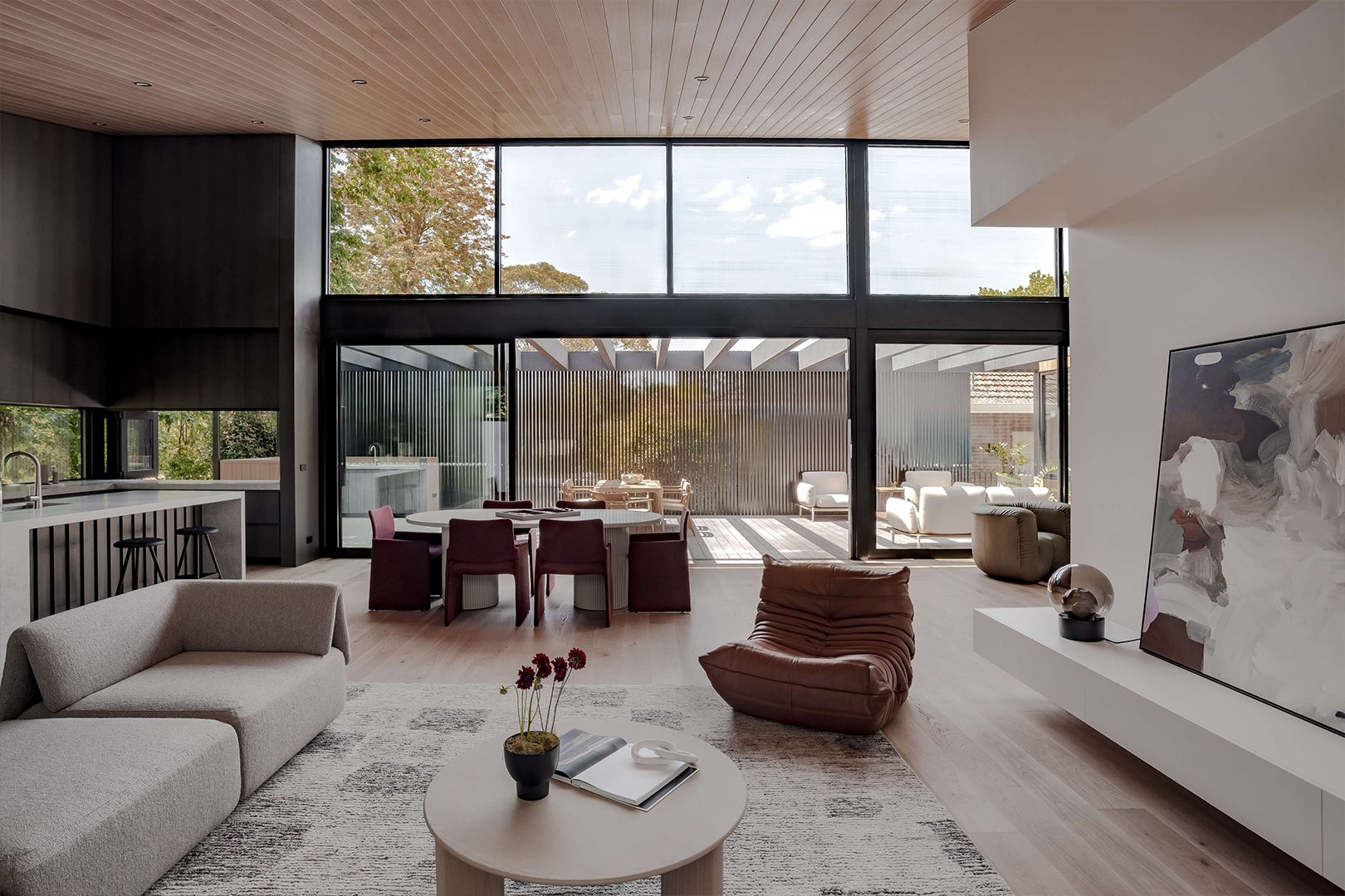 Eaglemont Timber House by Sky Architect Studio, a Melbourne architect specializing in modern architecture, showcases a refined blend of natural timber, clean lines, and expansive glazing. This contemporary residence emphasizes seamless indoor-outdoor living, with a warm material palette and thoughtfully crafted details that enhance its sophisticated yet inviting aesthetic.