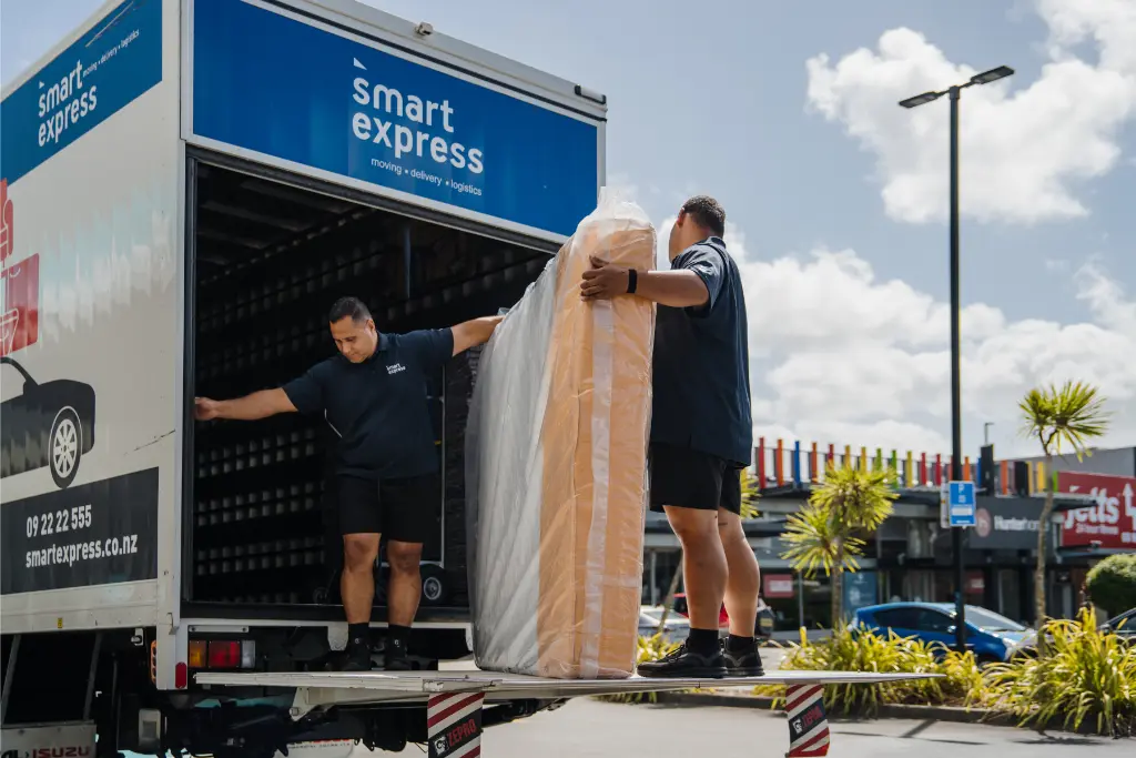 furniture movers handling mattress