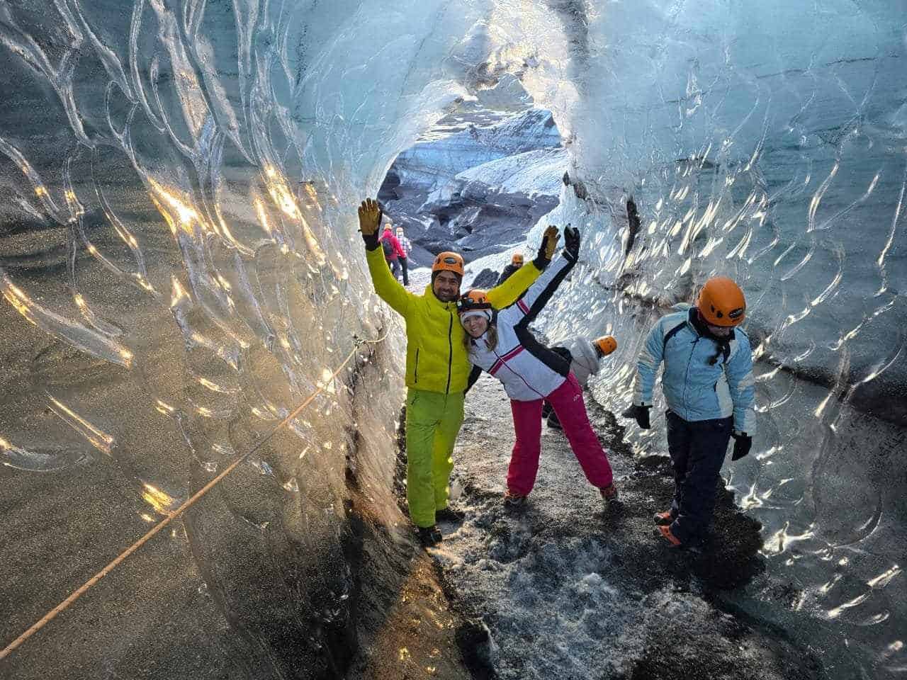 People standing inside Katla Ice Cave