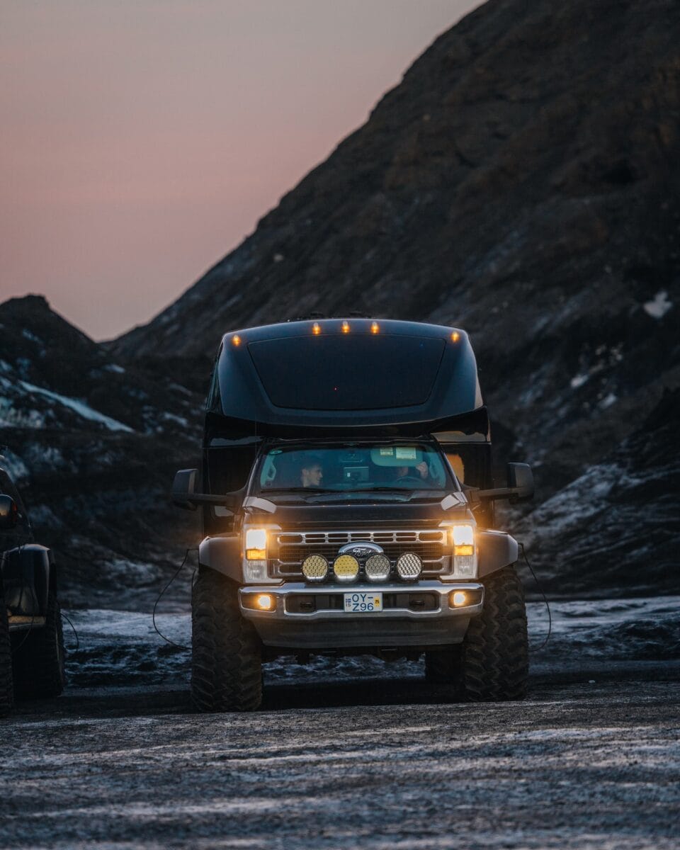 A Super Jeep's front part with mountains in the background on Southcoast Adventures tour