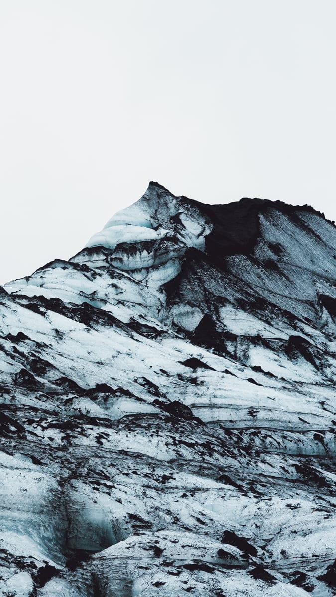 Icy mountain of Katla with black dirt