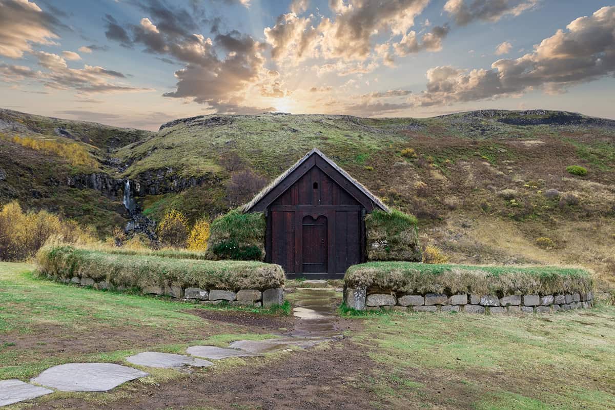A small hut in south Iceland with a colorful sunset