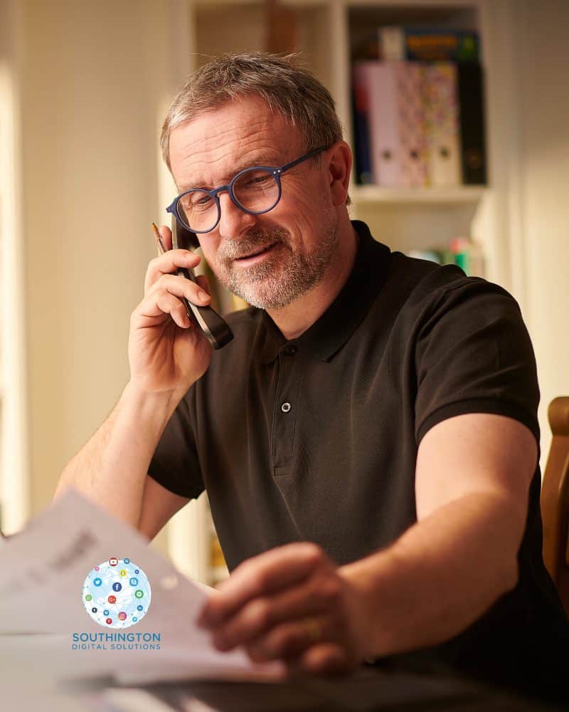 Small business owner securing a new lead over the phone