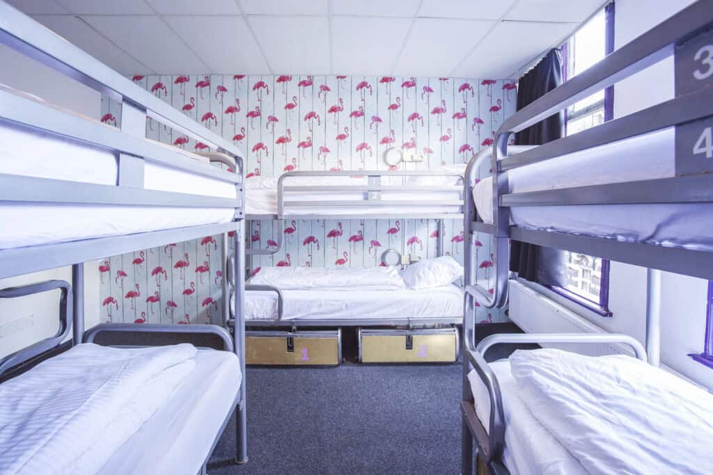 Hostel bunk beds with metal frames at Flying Pig Downtown, a popular budget accommodation in the cit.
