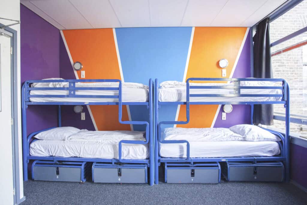 Modern bunk beds in colourful hostel dorm room at Flying Pig Downtown, Amsterdam.