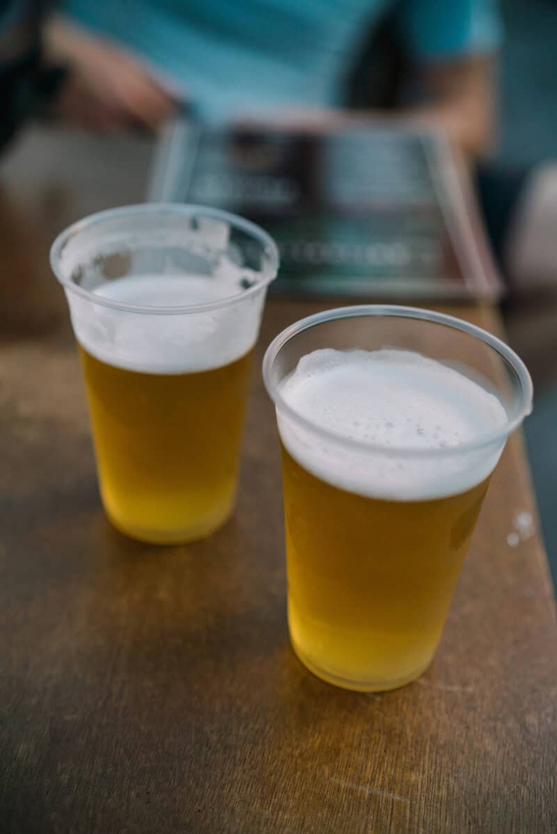 Two pints of beer on a table at The Flying Pig Downtown hostel in Amsterdam.