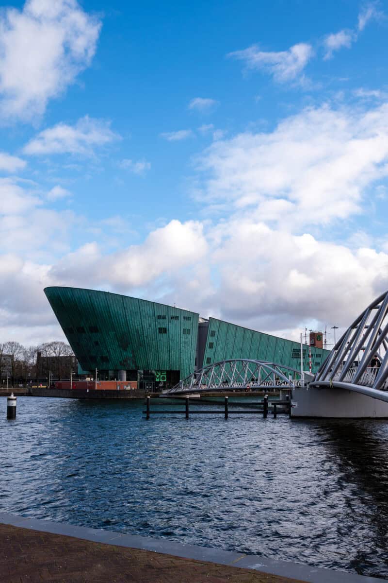 View of The Flying Pig Downtown hostel in Edinburgh with modern architecture and riverfront setting.