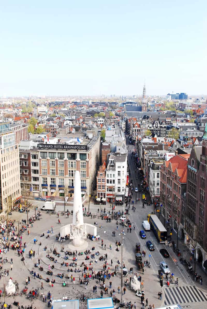 View of Dam Square in Amsterdam from Flying Pig Downtown hostel, showing city streets and historic.