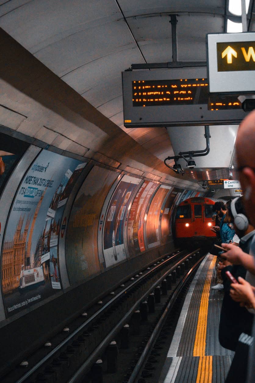 Liverpool Street Station platform with passengers waiting for the train.