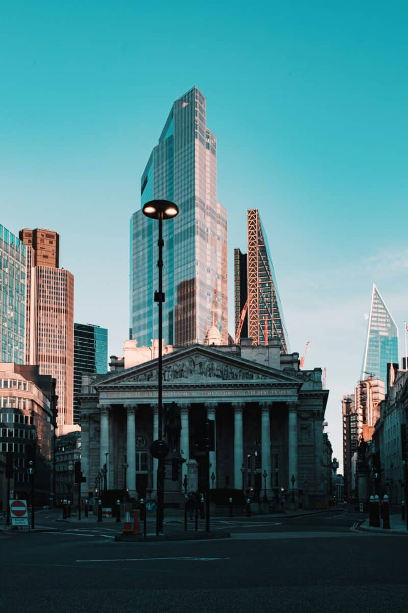 View of Liverpool Street with modern skyscrapers and historic buildings in London.