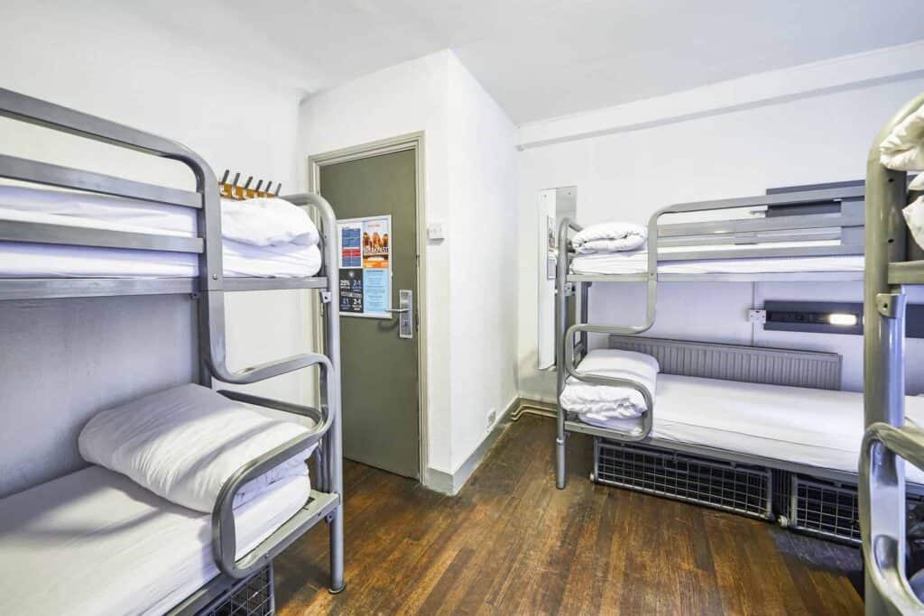 Shared dorms at St Christopher's Inn London Bridge - The Inn, with bunk beds and wooden flooring.