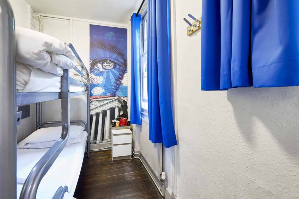 St Christopher's Inn London Bridge - The Inn private room with bunk beds and blue curtains.