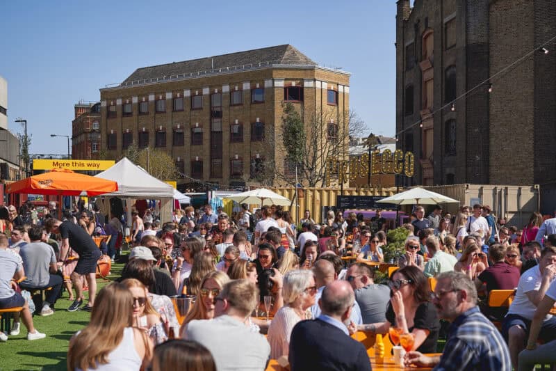 St Christopher's Inn London Bridge - The Inn outdoor area with market stalls and seating near London.